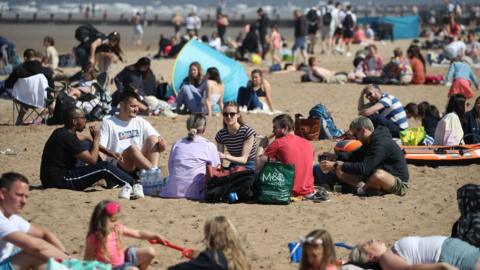 people on the beach at Portobello