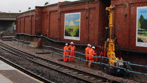 Track and workers at Hartlepool railway station carrying out piling work