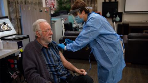 Care home resident Michael Starr, 78, receives an injection of the coronavirus vaccine at Andrew Cohen House in Birmingham