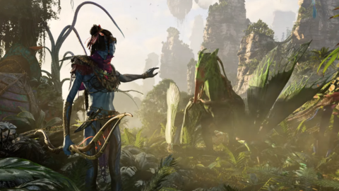 A blue-skinned alien from the Avatar film series stretches a hand out to a flying animal in this game screenshot