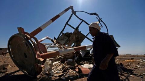 A Yemeni man walks past a navigation station at Sanaa International Airport that was destroyed in Saudi-led air strikes in the Yemeni capital on 15 November 2017.