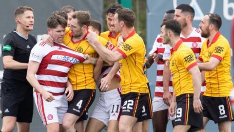 Players from Hamilton and Partick Thistle grapple
