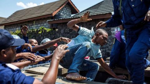 Congolese National Police arrest a man in Goma, on December 27, 2018