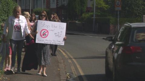 Campaigners hold protest with placard