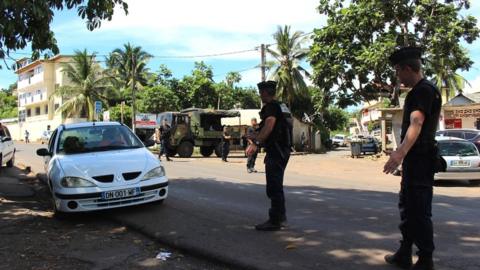 Gendarmes control the road traffic and check IDs on 15 March 2018 in Majicavo in the French overseas territory of Mayotte