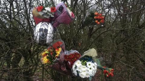 Flowers left after the crash on Thursday at Sculthorpe, near Fakenham