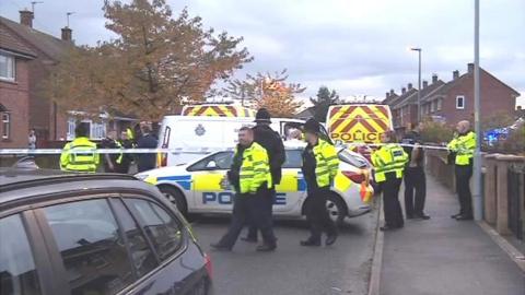 Police officers at the scene of the accident