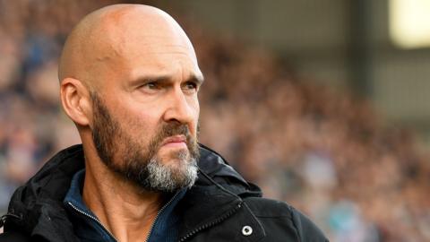 Notts County boss Luke Williams watches his side from the side of the pitch