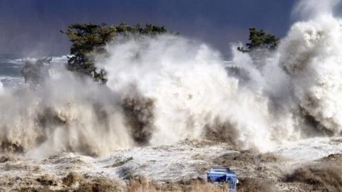 Tsunami waves hit the coast of Minamisoma in Fukushima prefecture, 2011