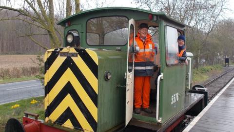 Volunteers with diesel shunter on railway