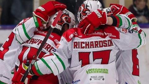 Cardiff Devils in a huddle at Manchester Storm