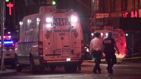 Police at the crime scene of killings in New York