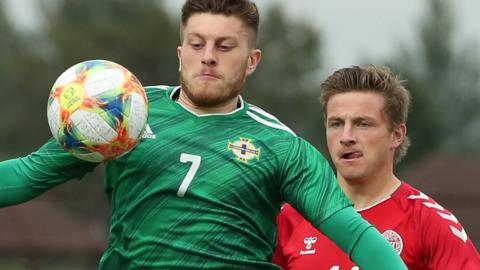 NI's Nathan Kerr shields the ball in the U21 qualifier against Denmark