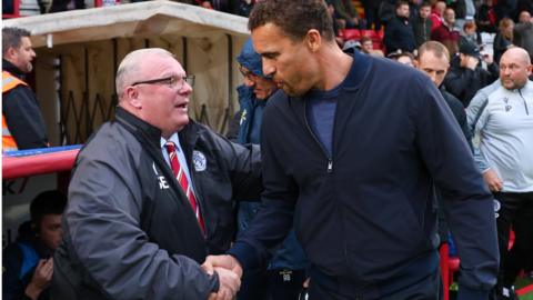 Steve Evans shakes hands with Watford boss Valerien Ismael at the end of the game