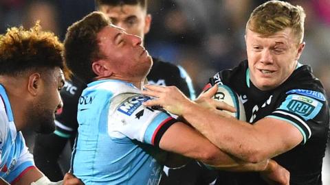 Keiran Williams of Ospreys (R) and Duncan Weir of Glasgow clash heads resulting in a yellow card for Weir