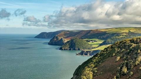 Looking east from the South West Coast Path to Wringapeak and across Woody Bay with Crock Point, Lee Abbey and Foreland Point in the distance, Exmoor National Park