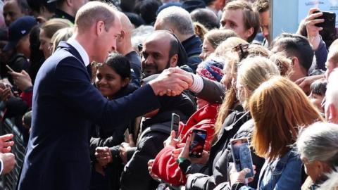 Prince William meets people in the queue