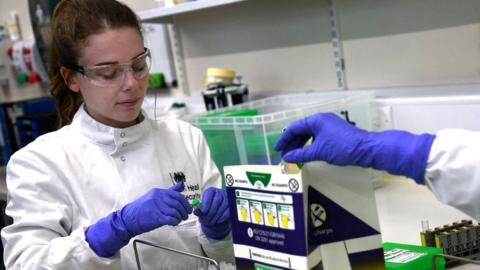 Lab technicians prepare samples at one of the new labs at the Health Security Agency, Porton Down, Salisbury