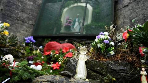 Floral tributes at a graveyard in Tuam where the bodies of 796 babies were found