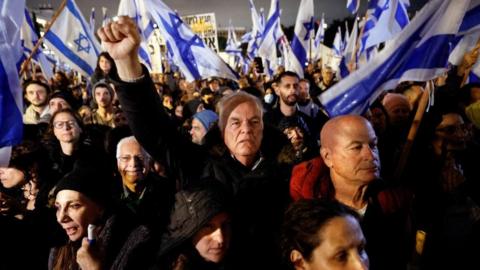 Israelis protest against Prime Minister Benjamin Netanyahu's new right-wing coalition and its proposed judicial reforms to reduce powers of the Supreme Court in a main square in Tel Aviv, Israel January 14, 2023.