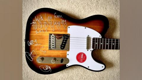 Picture of signed guitar from Coldplay
