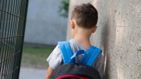 A generic image of a boy with a rucksack on