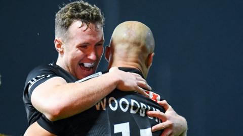 Exeter celebrate Olly Woodburn's try