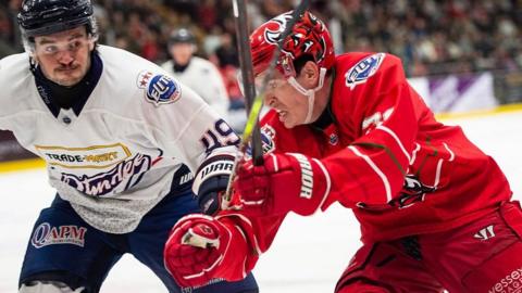 Cardiff Devils’ Ryan Barrow battles with Dundee Stars’ Xavier Pouliot in the Elite League Playoff quarterfinal first leg