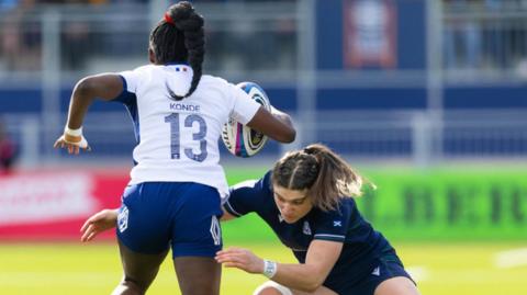France's Nassira Konde evades a tackle