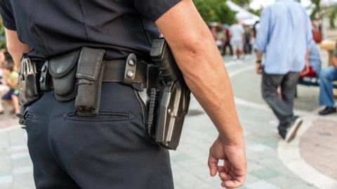 Police officer with gun