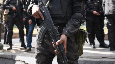 Egyptian police special forces stand guard in Cairo's Tahrir Square on 25 January 2016