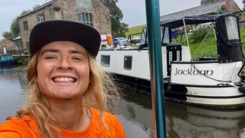 Beth Roberts takes selfie during the journey on a canal