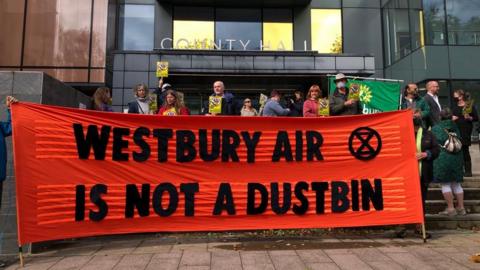 Protesters gathered outside the County Hall ahead of the meeting