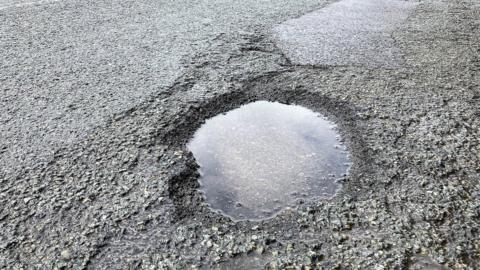 A pothole on a main road in Stockwood, Bristol