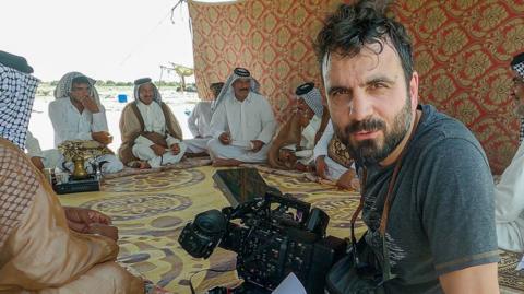 Namak Khoshnaw, director, Life at 50C, looking at the camera