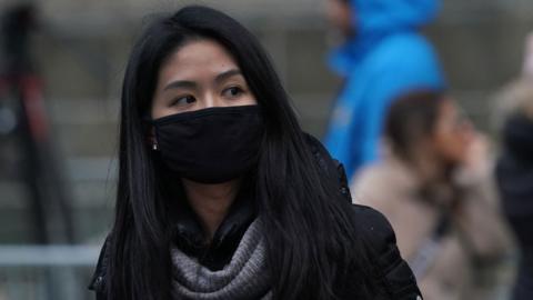 Woman in NYC wearing mask