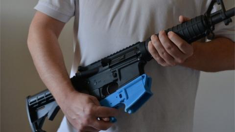 An AR-15 assault rifle along with a 3D-printed lower receiver
