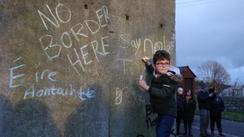 Boy at anti-border protest in County Louth