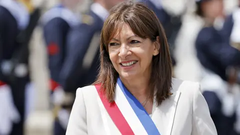 Anne Hidalgo wears a French flag sash while attending an event in Paris on 8 June