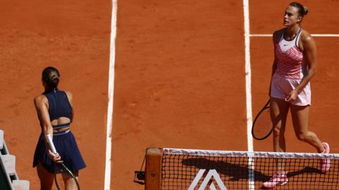 Marta Kostyuk walks to her chair without shaking Aryna Sabalenka's hand