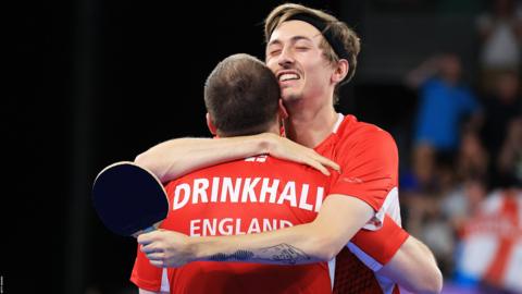 Liam Pitchford and Paul Drinkhall hugging after winning gold
