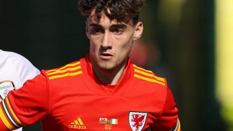 Niall Huggins in action for Wales Under-21s