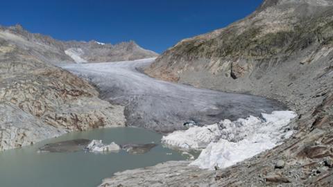 Parts of the Rhone Glacier are covered with blankets to protect the ice against melting in Obergoms