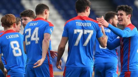 Inverness players celebrate the winning goal