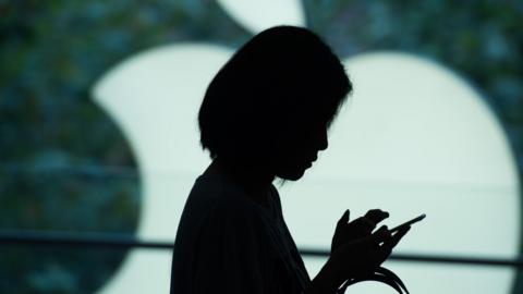 silhouette of woman on phone