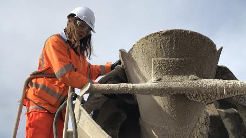 Emily Burridge inspects a batch of concrete