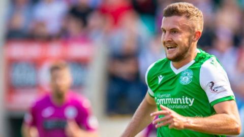 Tom James (right) in action for Hibernian