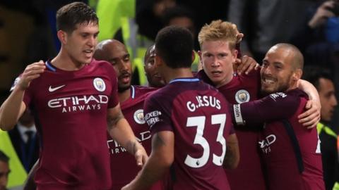 Manchester City celebrate scoring at Chelsea