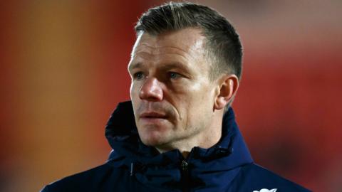 Scarlets boss Dwayne Peel watches his team warm up