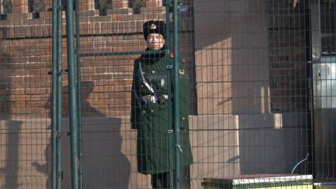 A Chinese paramilitary police stands guard outside the British embassy in Beijing on January 8, 2024.